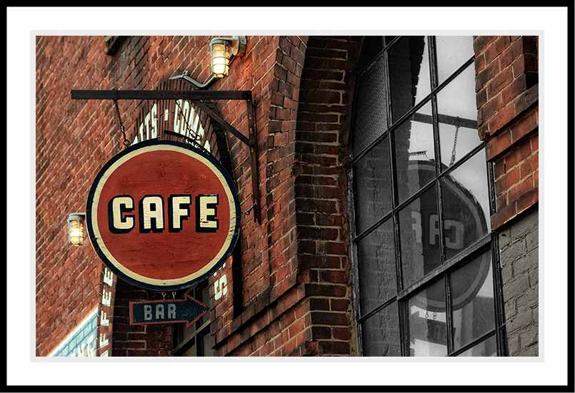 Hanging Cafe sign in soft reddish brown colors.